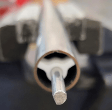 Install Teflon spacer flush with end of tube